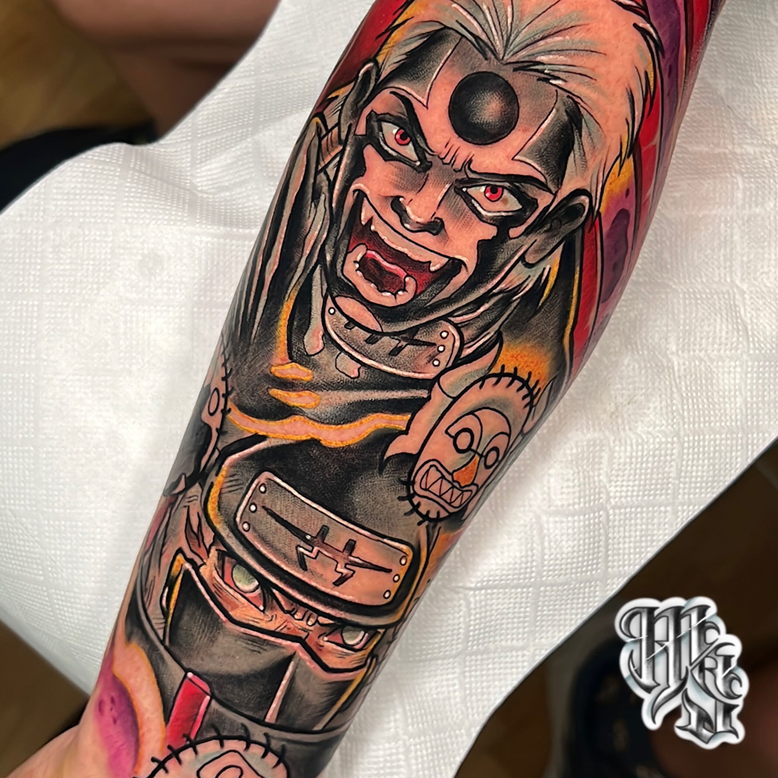 Tatuaje de anime de la serie naruto ninja a todo color, realizado con los mejores materiales en estudio profesional de madrid, vallecas, aluche y mostoles